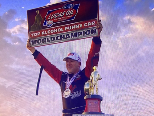 Sean Bellemeur holding the World Champion banner